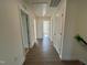 Hallway with many doors and luxury vinyl plank flooring at 88 Willow Cameron Way, Angier, NC 27501