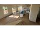 Open-concept kitchen with white cabinets, a center island and lots of windows for natural light at 88 Willow Cameron Way, Angier, NC 27501