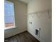 The laundry room has hardwood floors and a wire shelf at 88 Willow Cameron Way, Angier, NC 27501