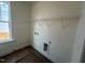 Empty laundry room featuring a window and a shelf at 88 Willow Cameron Way, Angier, NC 27501