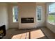 Living room boasts fireplace, large windows overlooking the yard, and ample natural light at 88 Willow Cameron Way, Angier, NC 27501