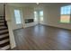 Spacious living room has lots of natural light and a modern electric fireplace at 88 Willow Cameron Way, Angier, NC 27501