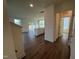 Open living area with hardwood floors and an island with sink at 88 Willow Cameron Way, Angier, NC 27501