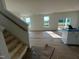 Staircase in the living room area with a view of the backyard at 88 Willow Cameron Way, Angier, NC 27501
