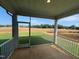Screened-in back porch with white railings overlooking expansive lawn at 88 Willow Cameron Way, Angier, NC 27501