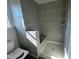 Tiled shower with a built-in seat and modern fixtures at 88 Willow Cameron Way, Angier, NC 27501