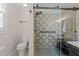 Bathroom with a glass shower enclosure and tiled walls at 8808 Colesbury Dr, Raleigh, NC 27615