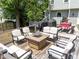 Outdoor deck with patio furniture, firepit, grill and outdoor dining table at 8808 Colesbury Dr, Raleigh, NC 27615