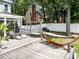 Spacious deck with seating and lounge chairs, a porch swing, and hammock for relaxation at 8808 Colesbury Dr, Raleigh, NC 27615