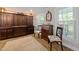 Dining area featuring hardwood floors, custom built-ins and natural lighting, inviting comfort and style at 8808 Colesbury Dr, Raleigh, NC 27615