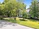 Charming two-story home with mature trees and a well-manicured lawn at 8808 Colesbury Dr, Raleigh, NC 27615
