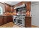Gourmet kitchen featuring a high-end range hood and oven, ideal for culinary enthusiasts at 8808 Colesbury Dr, Raleigh, NC 27615