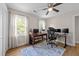 Office space with wood flooring, a ceiling fan, and abundant natural light at 8808 Colesbury Dr, Raleigh, NC 27615