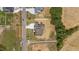 An aerial perspective displays the property's spacious lot with manicured landscaping in a suburban neighborhood at 90 Lane Farms Way Way, Holly Springs, NC 27540