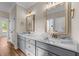 A bathroom featuring double vanity sinks and a marble countertop at 90 Lane Farms Way Way, Holly Springs, NC 27540
