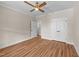 An empty bedroom with wood flooring, ceiling fan, and a closet at 90 Lane Farms Way Way, Holly Springs, NC 27540