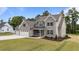 Well-manicured lawn and landscaping enhance the curb appeal of this inviting two-story home at 90 Lane Farms Way Way, Holly Springs, NC 27540