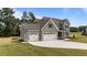 This well-maintained home features a spacious three-car garage and beautifully landscaped front yard at 90 Lane Farms Way Way, Holly Springs, NC 27540