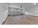 Spacious two-car garage with overhead door and brick accents at 90 Lane Farms Way Way, Holly Springs, NC 27540
