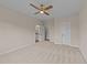 Carpeted main bedroom featuring two doors and access to the bathroom at 90 Lane Farms Way Way, Holly Springs, NC 27540