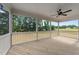 Covered porch features wood flooring, white railing and ceiling fan at 90 Lane Farms Way Way, Holly Springs, NC 27540