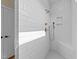 A modern shower with white subway tile and a built-in shower bench at 90 Lane Farms Way Way, Holly Springs, NC 27540