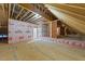 A large unfinished attic featuring prepped flooring and exposed framework at 90 Lane Farms Way Way, Holly Springs, NC 27540