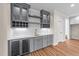Charming wet bar featuring gray cabinets, a wine cooler, and marble backsplash at 90 Lane Farms Way Way, Holly Springs, NC 27540