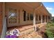 Inviting front porch with brick flooring and decorative details, creating a warm and welcoming entrance at 913 Milton Rd, Durham, NC 27712