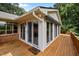 Bright sunroom with multiple sliding doors and wooden deck, perfect for relaxing and entertaining at 913 Milton Rd, Durham, NC 27712