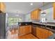 Updated kitchen with stainless steel appliances, granite countertops, and classic wood cabinets at 1001 Pasture View Ln, Raleigh, NC 27603