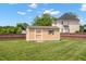 View of the backyard storage shed, providing ample space for gardening tools and equipment at 1001 Pasture View Ln, Raleigh, NC 27603