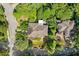 Home surrounded by mature trees, showing neighborhood layout and landscape features at 101 Cardiff Pl, Chapel Hill, NC 27516