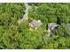 Aerial view of a well-maintained property nestled among lush trees in a serene neighborhood at 101 Cardiff Pl, Chapel Hill, NC 27516