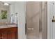 Bathroom features a tile shower with glass door and a wooden vanity with sink at 101 Cardiff Pl, Chapel Hill, NC 27516