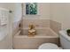 Cozy bathroom features a bathtub and a wooden tray at 101 Cardiff Pl, Chapel Hill, NC 27516