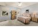Bedroom features light blue walls and carpet and large windows that provide natural light at 101 Cardiff Pl, Chapel Hill, NC 27516