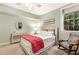 Cozy bedroom showcases a comfortable bed, rocking chair, and natural light from the window at 101 Cardiff Pl, Chapel Hill, NC 27516