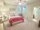 Cozy bedroom featuring a ceiling fan, en suite bathroom and light green walls, offering a relaxing retreat at 101 Cardiff Pl, Chapel Hill, NC 27516
