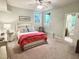 Cozy bedroom features natural light, ceiling fan, and en-suite bathroom at 101 Cardiff Pl, Chapel Hill, NC 27516