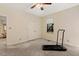 Bedroom features neutral walls, carpet, large closet, and an included treadmill at 101 Cardiff Pl, Chapel Hill, NC 27516