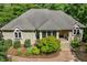 A brick home is beautifully landscaped with manicured shrubbery and an inviting brick walkway at 101 Cardiff Pl, Chapel Hill, NC 27516
