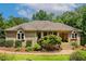Attractive brick home featuring manicured landscaping and inviting front entryway at 101 Cardiff Pl, Chapel Hill, NC 27516