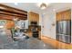 Modern kitchen boasting granite countertops, stainless steel appliances, and wood beam ceiling at 101 Cardiff Pl, Chapel Hill, NC 27516