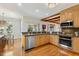 Bright kitchen features stainless steel appliances, wood cabinets and countertops, open to the breakfast nook at 101 Cardiff Pl, Chapel Hill, NC 27516
