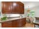 This kitchen has wooden cabinets, countertops, and it opens to a dining room at 101 Cardiff Pl, Chapel Hill, NC 27516