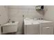 Laundry room features a utility sink, and front loading washer and dryer at 101 Cardiff Pl, Chapel Hill, NC 27516