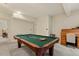 Bright living room with pool table and adjacent roll top desk, perfect for work and play at 101 Cardiff Pl, Chapel Hill, NC 27516