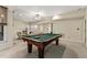 Living area with recreational options and views to adjoining rooms, perfect for relaxing and entertaining at 101 Cardiff Pl, Chapel Hill, NC 27516