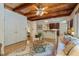 Living room with wood ceiling, floors, and access to kitchen and backyard at 101 Cardiff Pl, Chapel Hill, NC 27516